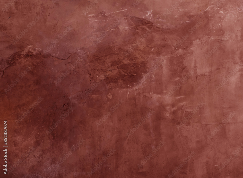 Fototapeta premium red cracked stone wall background close up