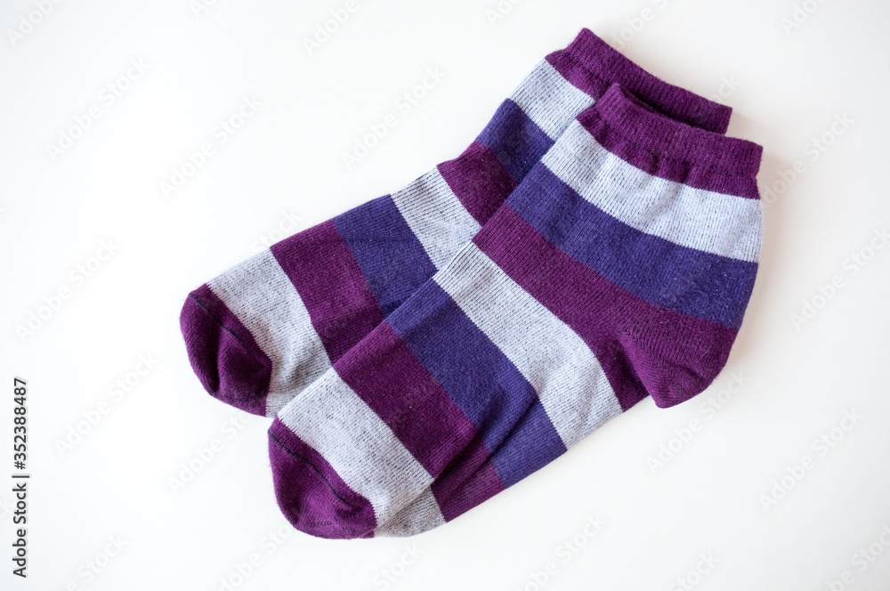 Socks with colored stripes on a light background Socks with colored stripes on a light background