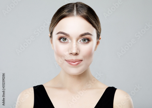 Portrait of young happy woman with health skin of face