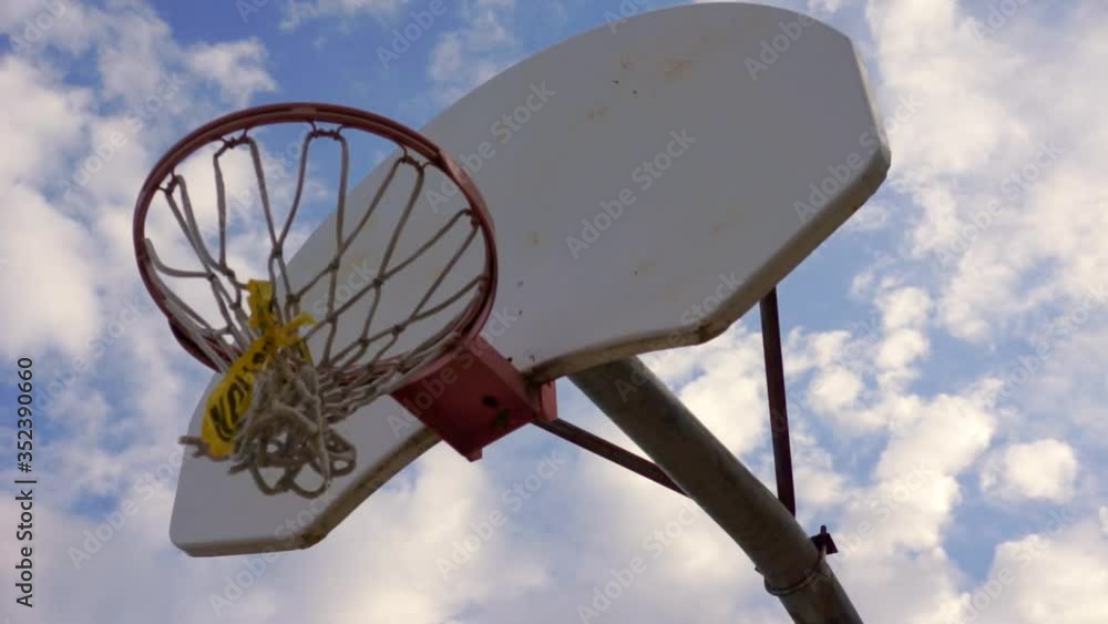 Basketball Net Tied With Caution Tape During Covid19 Lockdown Basketball Net Tied With Caution Tape During Covid19 Lockdown
