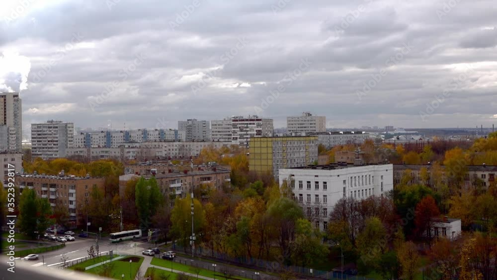 time laps video from the 10th floor to a sleeping area of Moscow autumn day. Moscow time lapse crossroads with cars and people, changing light on colorful trees time laps video from the 10th floor to a sleeping area of Moscow autumn day. Moscow time lapse crossroads with cars and people, changing light on colorful trees