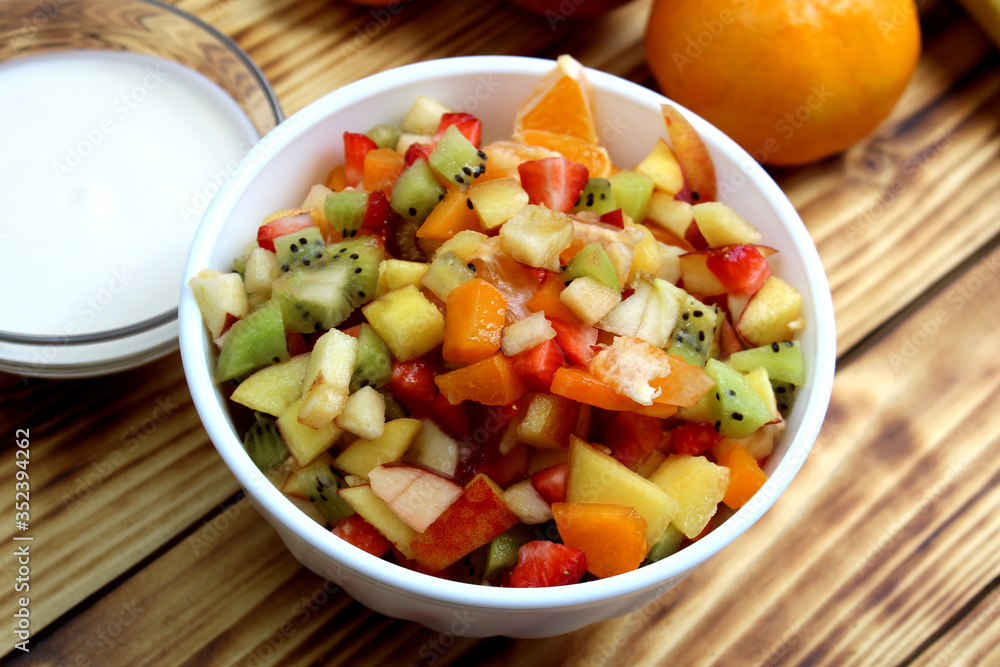 Chopped fruit salad in a white plate Chopped fruit salad in a white plate
