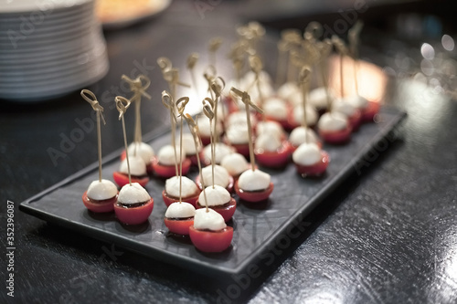 Abstract set of tomato canapes on a tray