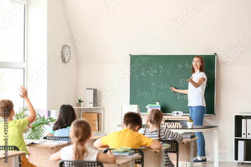 Math teacher conducting lesson in classroom