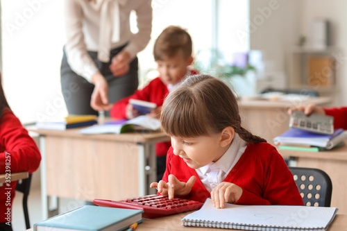 Little girl doing math task...