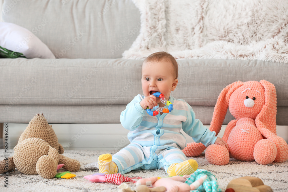 Cute little baby playing with toys at home Cute little baby playing with toys at home
