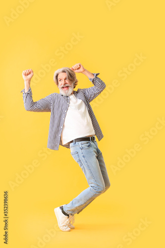 Cool senior man dancing aga...