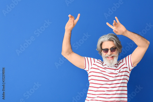 Cool senior man dancing aga...