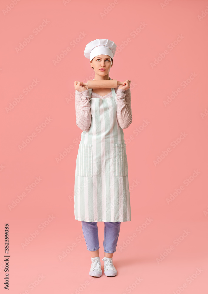 Beautiful female chef on color background Beautiful female chef on color background