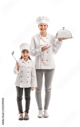 Portrait of female chef and...