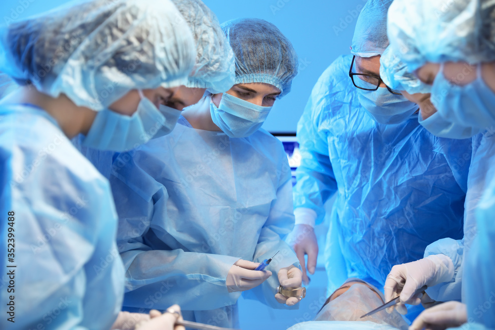 Operating of patient in modern hospital Operating of patient in modern hospital