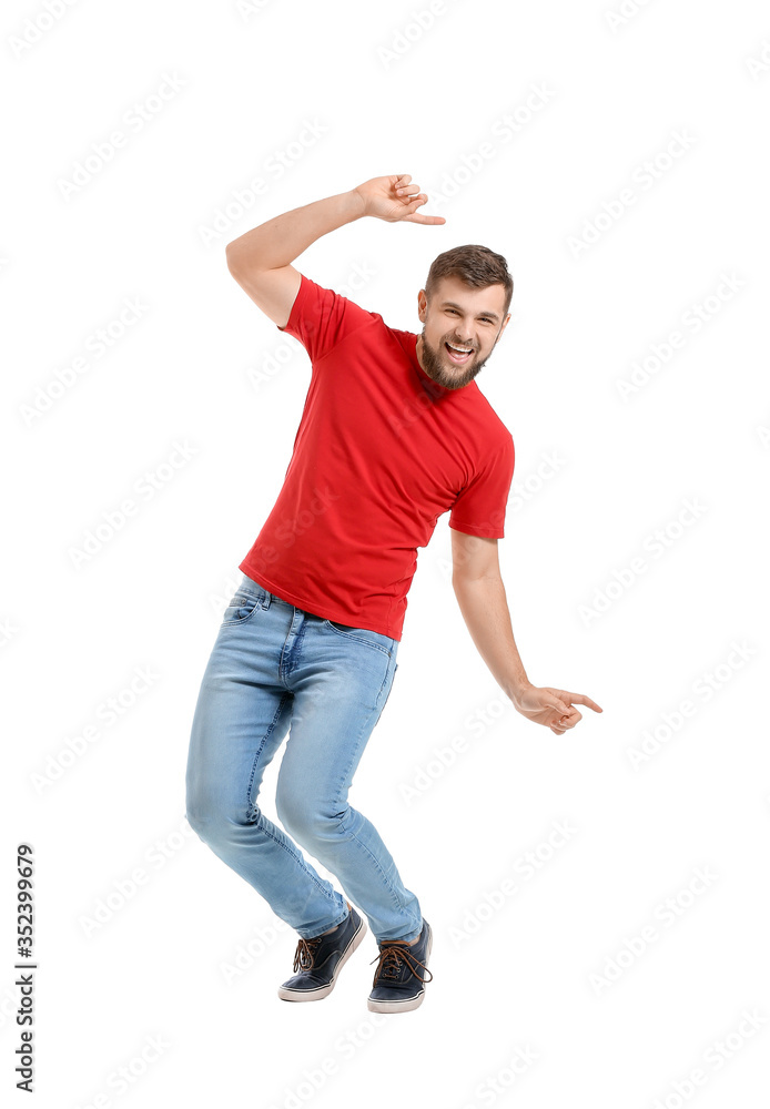 Handsome young man dancing against white background