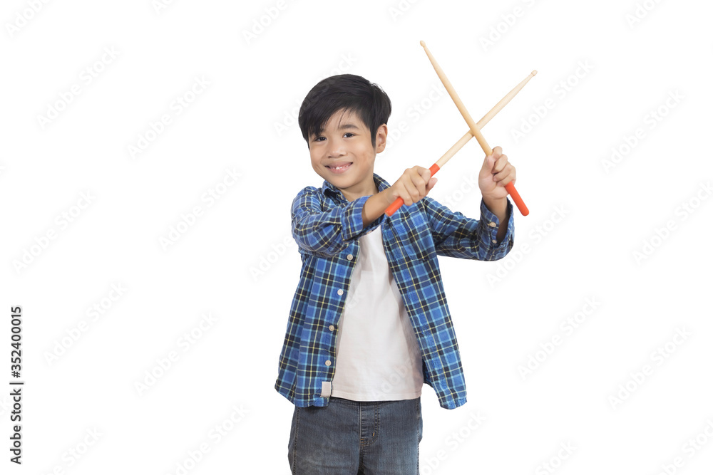 A portrait of a young Asian elementary school student wearing a plaid shirt and a drumstick. An isolated image with white background. A portrait of a young Asian elementary school student wearing a plaid shirt and a drumstick. An isolated image with white background.