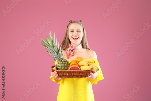 Young woman with fruits on ...