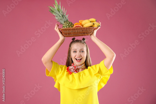 Young woman with fruits on ...