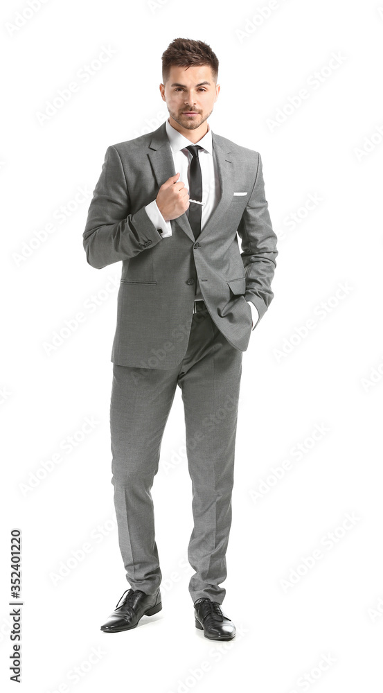 Handsome young man in elegant suit on white background Handsome young man in elegant suit on white background
