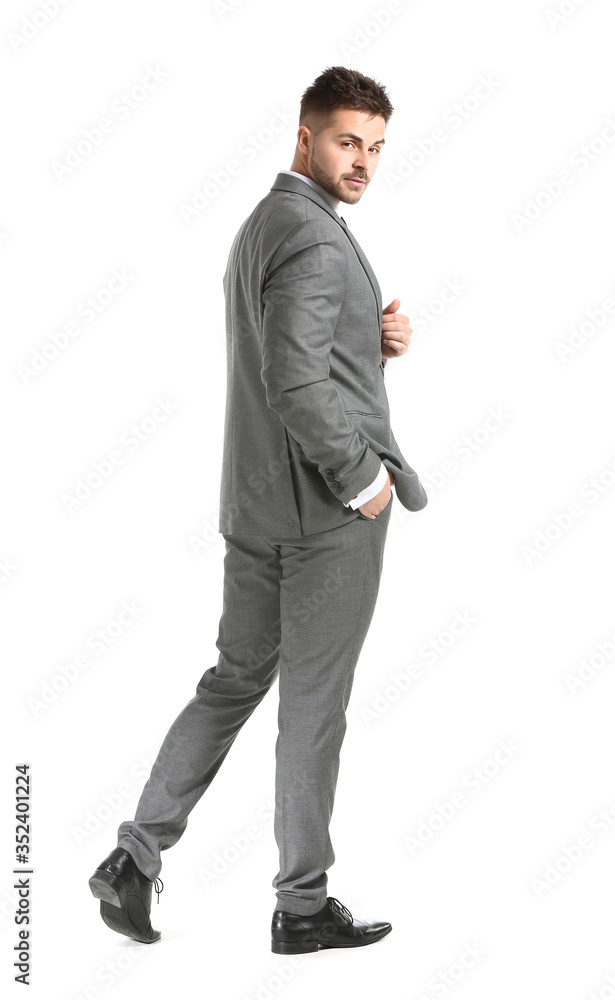 Handsome young man in elegant suit on white background Handsome young man in elegant suit on white background