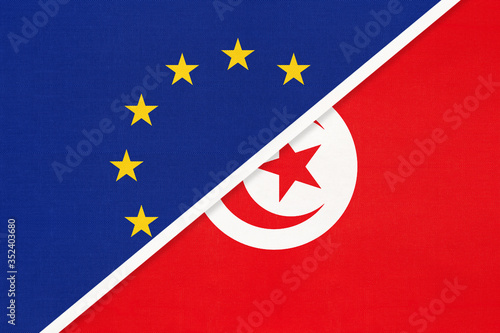 European Union or EU and Tunisia national flag from textile. Symbol of the Council of Europe association.