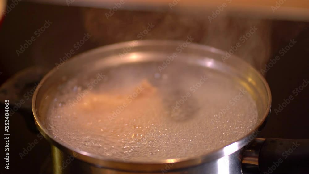 Preparing soup in boiling pot Preparing soup in boiling pot