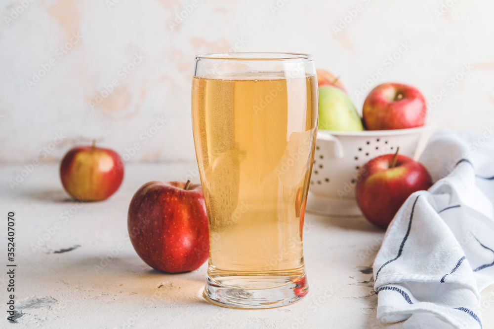 Glass of apple cider on table Glass of apple cider on table