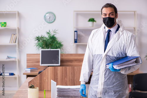 Young male employee in self-isolation concept