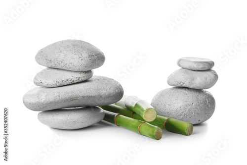 Zen stones and bamboo on white background