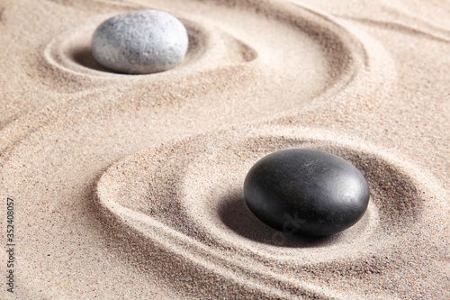 Stones on sand with lines. Zen concept