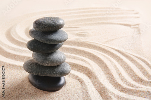 Stones on sand with lines. Zen concept