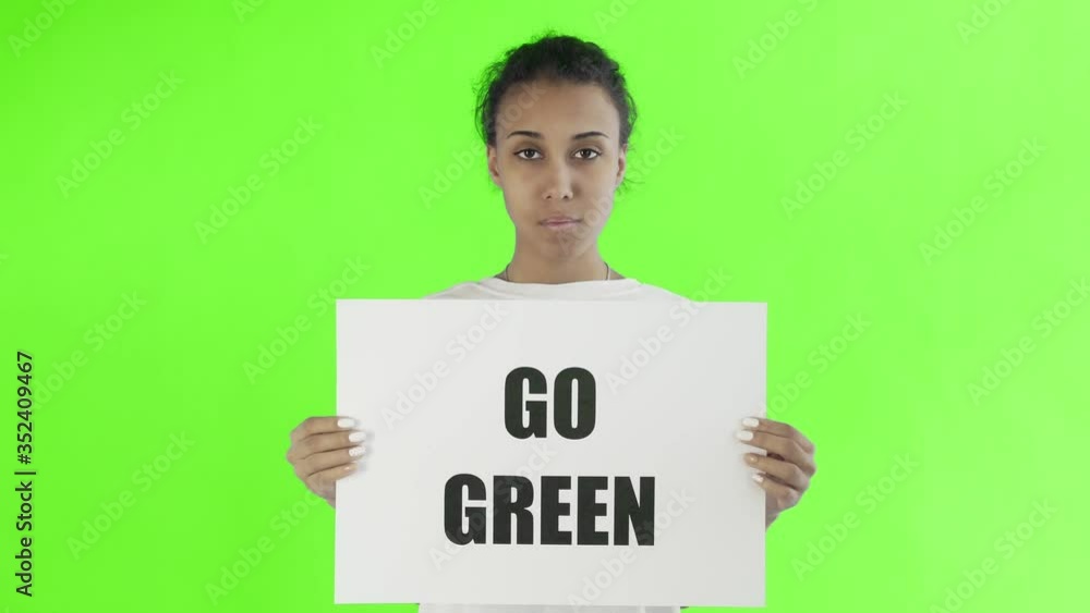 Afro-American Girl Activist With Save The Planet Poster on chroma key background Afro-American Girl Activist With Save The Planet Poster on chroma key background