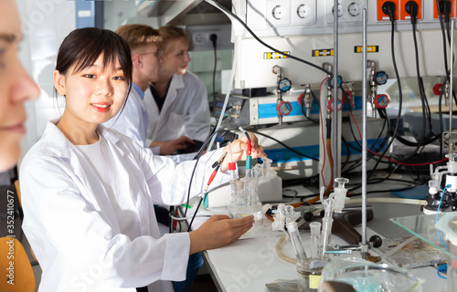 Serious Chinese female scientist at lab
