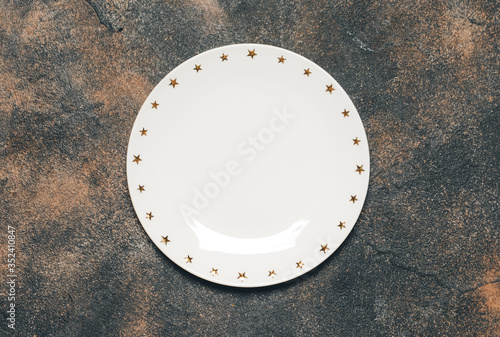 Ceramic plate on grunge background