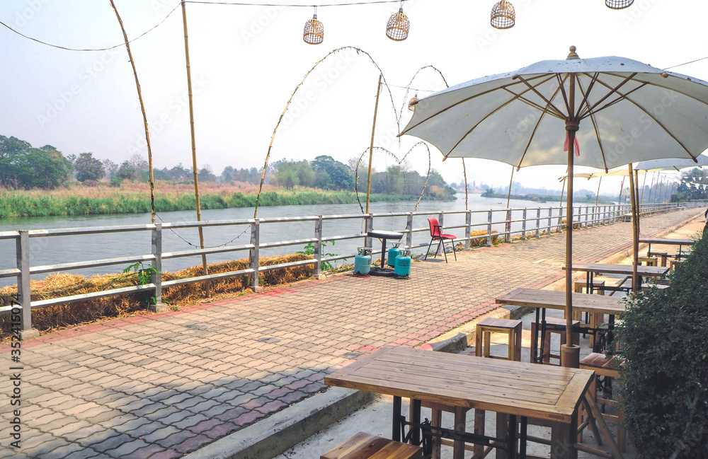 Seating table and umbrella with a waterfront atmosphere