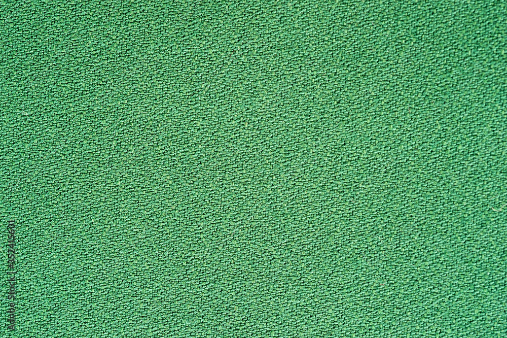 Fototapeta premium Fragment of a light green fabric, for fabrics of dresses and suits.