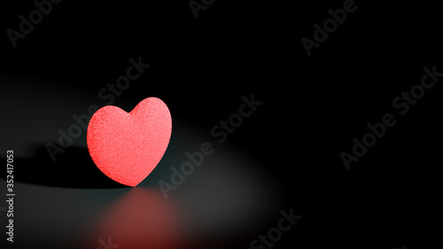 3D illustration with a sponge textured red heart in the spot light in the black background