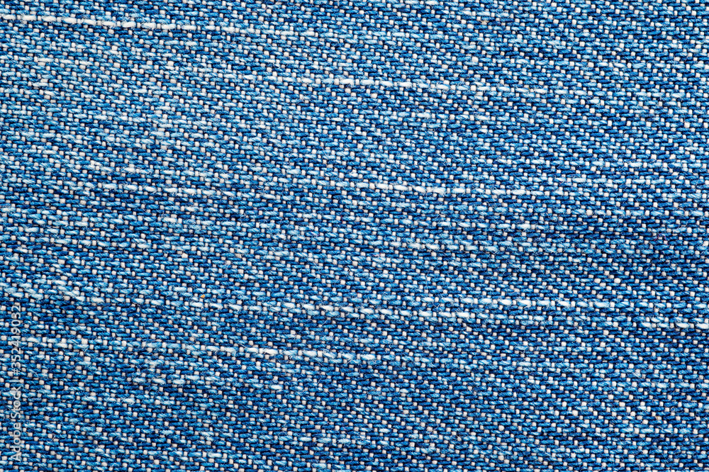 Close-up stretch denim. Background for the texture of outerwear and fashion. Close-up stretch denim. Background for the texture of outerwear and fashion.