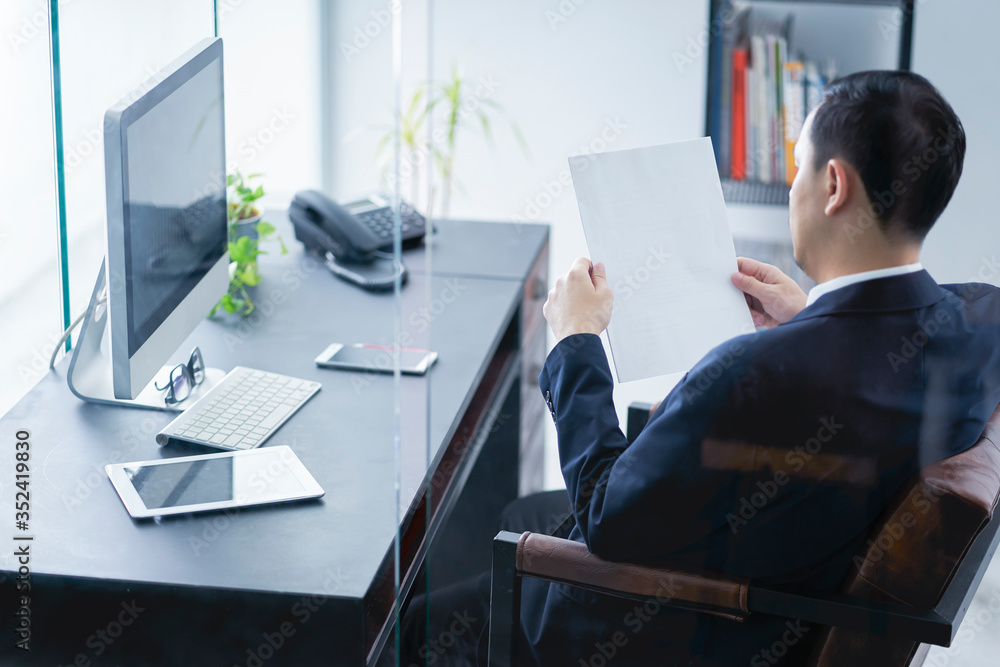 Young business man holding blank paper in hands Young business man holding blank paper in hands