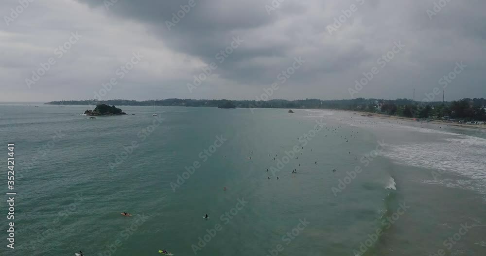 Busy Sri Lankan seaside, the Indian Ocean as a famous seasonal destination Busy Sri Lankan seaside, the Indian Ocean as a famous seasonal destination