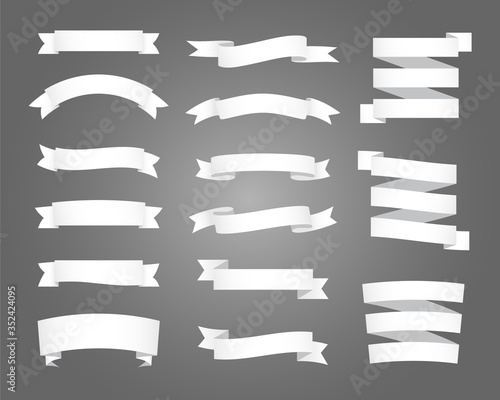 Set of white ribbon and banner on black background. Flat vector design.