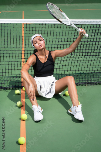 sexy girl in bikini playing tennis on the court © stryjek