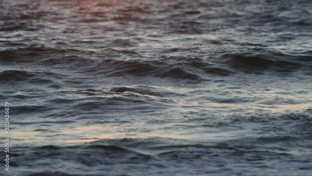 Sunset sea waves close-up. Baltic Sea waves at sunset Sunset sea waves close-up. Baltic Sea waves at sunset
