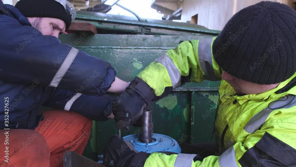 custom made wallpaper toronto digitalskilled workers use professional instruments and repair winch electric motor on modern Natig Aliev tanker close view