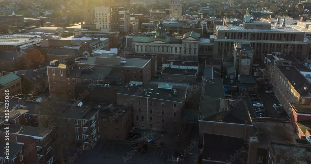 Aerial timelapse, hyperlapse of downtown Lancaster Pennsylvania city in USA during golden hour, traffic flows quickly through streets Aerial timelapse, hyperlapse of downtown Lancaster Pennsylvania city in USA during golden hour, traffic flows quickly through streets