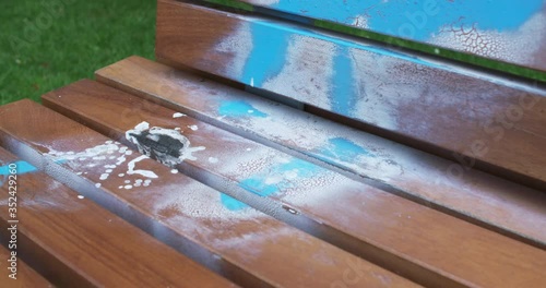 Pan of vandalised wooden summer seat