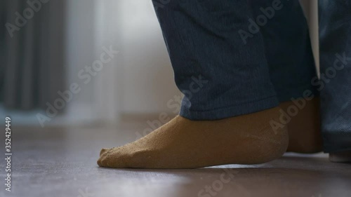 Foot Shakes Nervously As Person Waits In Distressed State. Domestic Violence Concept.