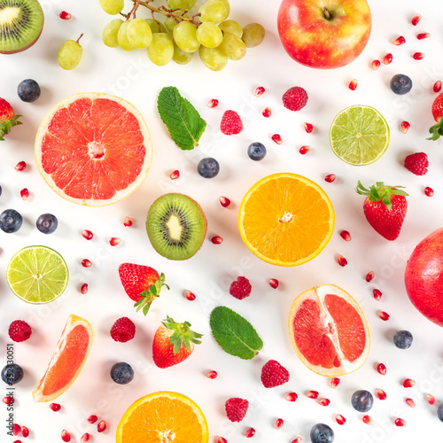 Fototapeta Naklejka Na Ścianę i Meble -  Fresh summer fruit, a flatlay on a white background, vibrant food design, overhead square shot