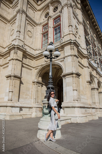 Canvas Print woman in dress near old building in Vienna