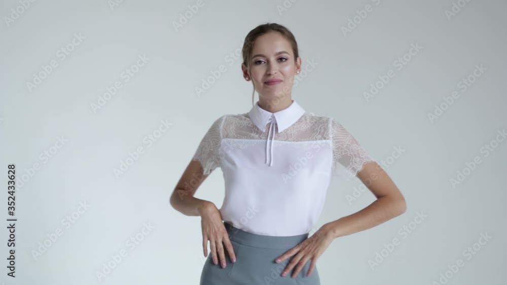 Sexy girl in short shirt on white background posing and smiling, glamorous girl,fashion model Sexy girl in short shirt on white background posing and smiling, glamorous girl,fashion model