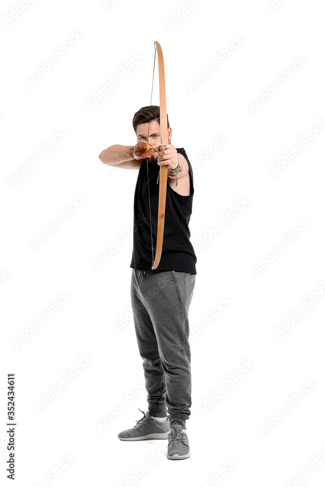 Handsome man with crossbow on white background Handsome man with crossbow on white background