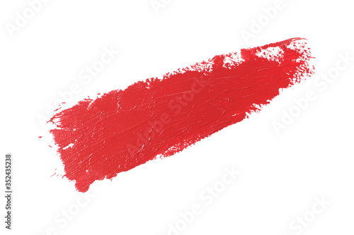 Red smear of lipstick isolated on the white background, close-up