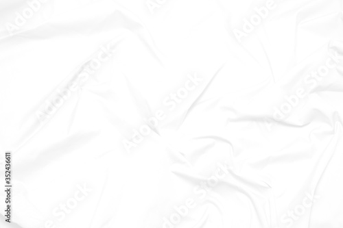 White fabric cloth background abstract with soft waves , flowing draped cloth in rippled elegant curves and wrinkled creases , soft focus, textured background and abstract